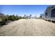 Vast backyard with lots of green space and trees, surrounded by neighboring homes at 208 Evanview Ct, Apex, NC 27523