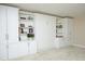 Versatile bedroom with a Murphy bed and ample built-in storage and shelving at 208 Evanview Ct, Apex, NC 27523
