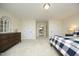 Spacious bedroom featuring neutral walls, carpet, and large furniture at 208 Evanview Ct, Apex, NC 27523
