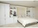 A murphy bed is built into this room's cabinetry, allowing it to be easily converted from bedroom to living space at 208 Evanview Ct, Apex, NC 27523