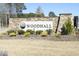 Stone entrance sign for Woodhall community at 208 Evanview Ct, Apex, NC 27523