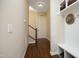Hallway area featuring stairs, mudroom, coat hooks, and storage at 208 Evanview Ct, Apex, NC 27523