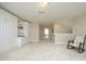 A light-filled open loft features built in cabinetry and a rocking chair at 208 Evanview Ct, Apex, NC 27523