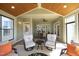 Relaxing sunroom with vaulted ceiling, comfortable seating, and a cozy atmosphere at 208 Evanview Ct, Apex, NC 27523