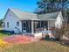 Home exterior with screened in back porch and patio at 2105 Antioch Church Rd, Timberlake, NC 27583