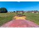 Wooden swing set on the edge of a concrete patio in a large, well-manicured backyard at 2105 Antioch Church Rd, Timberlake, NC 27583