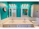 The bathroom has a double sink with white cabinets and blue walls at 2105 Antioch Church Rd, Timberlake, NC 27583