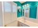 The bathroom features a white sink and blue walls with white cabinets at 2105 Antioch Church Rd, Timberlake, NC 27583