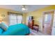 This bedroom has wood floors and a wooden dresser and bed with blue accents at 2105 Antioch Church Rd, Timberlake, NC 27583