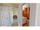 This hallway leads to a yellow bedroom and a bathroom with orange walls at 2105 Antioch Church Rd, Timberlake, NC 27583