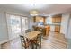 Eat-in kitchen with breakfast bar, stainless steel appliances, and a sliding glass door at 2105 Antioch Church Rd, Timberlake, NC 27583
