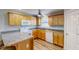 Efficient kitchen featuring light wood cabinetry and modern appliances at 2105 Antioch Church Rd, Timberlake, NC 27583