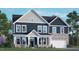 Beautiful two-story home featuring a two-car garage and a combination of stone and siding accents at 213 Umstead St, Sanford, NC 27330