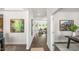 Long hallway that offers views to the dining area and living room with natural light and modern decor at 213 Umstead St, Sanford, NC 27330