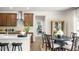 Modern kitchen showcasing a kitchen island, stainless steel appliances, and dark wood cabinetry at 213 Umstead St, Sanford, NC 27330