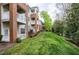 Apartment complex with brick facades, white balconies, and verdant lawn at 217 Waterford Lake Dr, Cary, NC 27519