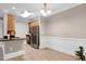 Eat-in kitchen space offering stainless steel appliances, wood cabinets, and an island with sink at 217 Waterford Lake Dr, Cary, NC 27519