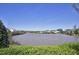Scenic view of a tranquil lake with lush greenery and houses visible in the background at 217 Waterford Lake Dr, Cary, NC 27519