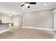 Open-concept with light wood flooring and white trim with view to dining area at 217 Waterford Lake Dr, Cary, NC 27519