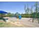 Vibrant playground with a variety of colorful play structures and swings for outdoor fun at 217 Waterford Lake Dr, Cary, NC 27519
