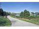 Scenic community walking path near the water with lush landscaping at 217 Waterford Lake Dr, Cary, NC 27519