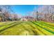 Expansive backyard with lush green lawn, mature trees, and a fenced perimeter at 2440 Helena Moriah Rd, Timberlake, NC 27583