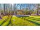 Backyard featuring a carport and ample shade for parking at 2440 Helena Moriah Rd, Timberlake, NC 27583