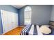 This bedroom features hardwood floors, a double closet, and a large window to bring in lots of light at 2440 Helena Moriah Rd, Timberlake, NC 27583