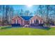 Charming single-story brick home with a well-manicured lawn and mature landscaping at 2440 Helena Moriah Rd, Timberlake, NC 27583