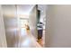 Hallway view of the home with hardwood floors that connect the living and kitchen spaces at 2440 Helena Moriah Rd, Timberlake, NC 27583