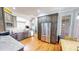 Modern kitchen featuring stainless steel appliances, custom cabinetry, and hardwood floors at 2440 Helena Moriah Rd, Timberlake, NC 27583