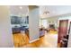 Open concept living room with kitchen and hardwood flooring at 2440 Helena Moriah Rd, Timberlake, NC 27583