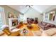Spacious living room features a brick fireplace, vaulted ceiling, lots of seating and hardwood floors at 2440 Helena Moriah Rd, Timberlake, NC 27583