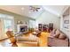 Bright living room with vaulted ceilings, fireplace, skylight, and hardwood flooring at 2440 Helena Moriah Rd, Timberlake, NC 27583