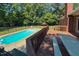 Backyard pool area featuring an in-ground pool, deck, and fenced yard at 2440 Helena Moriah Rd, Timberlake, NC 27583