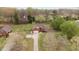 Sprawling property with a long drive, mature trees, and a charming brick home at 2563 Millbrook Dr, Haw River, NC 27258