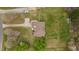 Overhead aerial view of a landscaped yard with a well maintained lawn and driveway at 2563 Millbrook Dr, Haw River, NC 27258