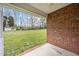 Spacious backyard with well-maintained lawn, shed, and wooded surroundings at 2563 Millbrook Dr, Haw River, NC 27258