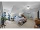 Bedroom features a bed, vaulted ceilings, bench, and a drying rack at 2563 Millbrook Dr, Haw River, NC 27258
