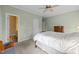 Cozy bedroom with soft carpet, light green walls, and classic wooden furniture at 2563 Millbrook Dr, Haw River, NC 27258
