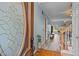 Inviting foyer with hardwood floors and a glimpse into the living room at 2563 Millbrook Dr, Haw River, NC 27258