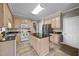 Functional kitchen with a center island, wooden cabinets, and stainless steel appliances at 2563 Millbrook Dr, Haw River, NC 27258