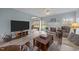 Open-concept living room featuring wood flooring, natural light, and neutral décor at 2563 Millbrook Dr, Haw River, NC 27258