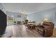 Bright living room featuring a fireplace, wood flooring and abundant natural light at 2563 Millbrook Dr, Haw River, NC 27258