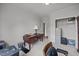 Office space with wooden desk and chair featuring a view into the adjacent room at 2563 Millbrook Dr, Haw River, NC 27258