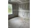 Bedroom with a large window overlooking trees and open drywall at 268 Dove Rd, Cameron, NC 28326