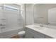 Bathroom with grey vanity, white countertops, and tub-shower combo at 280 Providence Creek Dr, Fuquay Varina, NC 27526