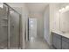 Bathroom featuring double sink vanity, tiled shower and floors at 280 Providence Creek Dr, Fuquay Varina, NC 27526