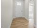 Inviting entryway features wood-look flooring and a white front door at 280 Providence Creek Dr, Fuquay Varina, NC 27526