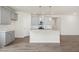Modern kitchen with gray cabinets, granite countertops, a center island, and stainless steel appliances at 280 Providence Creek Dr, Fuquay Varina, NC 27526